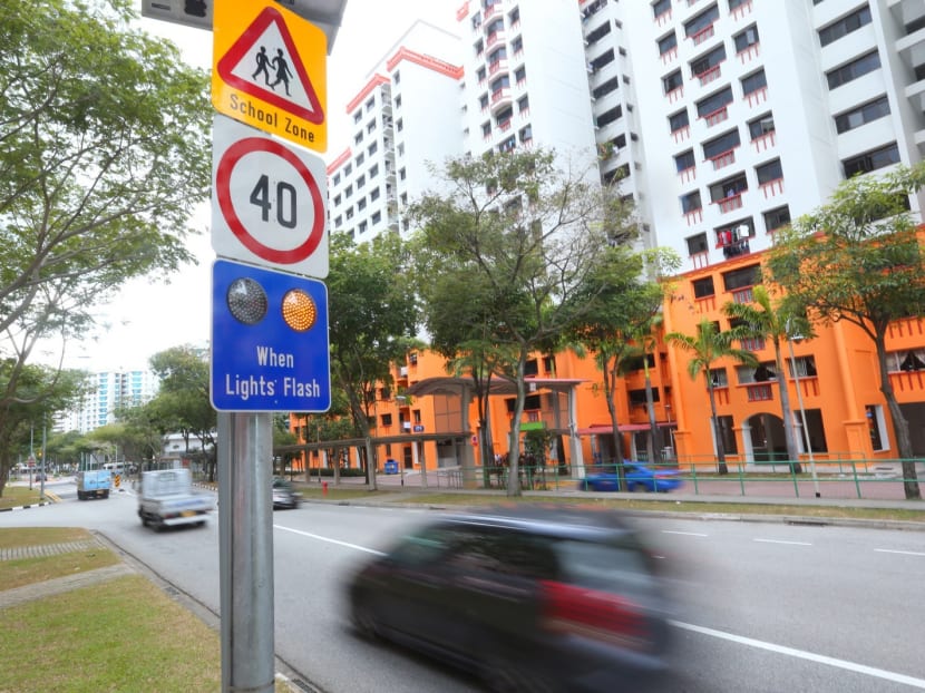 The new road sign to remind motorists to slow down for pedestrians at zebra crossings, along Admiralty Drive. Photo: Ernest Chua