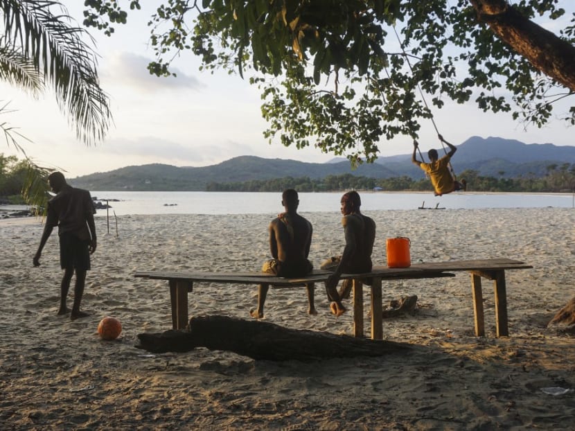 Teenagers at the Black Johnson beach, near Freetown, Sierra Leone, on May 23, 2021. Sierra Leoneans are protesting a planned industrial harbour in a lush village in the West African country over concerns the Chinese-financed project will destroy pristine rainforest and pollute the ocean.