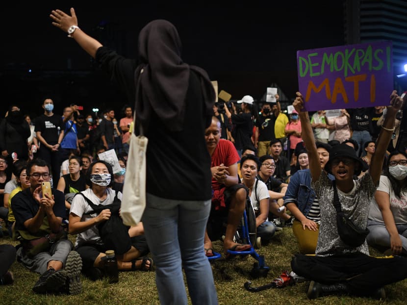 People listen to a speaker during a demonstration in Kuala Lumpur on Feb 29, 2020, after Mr Muhyiddin Yassin was appointed as Malaysia's next prime minister by the king following the collapse of a reformist ruling coalition.
