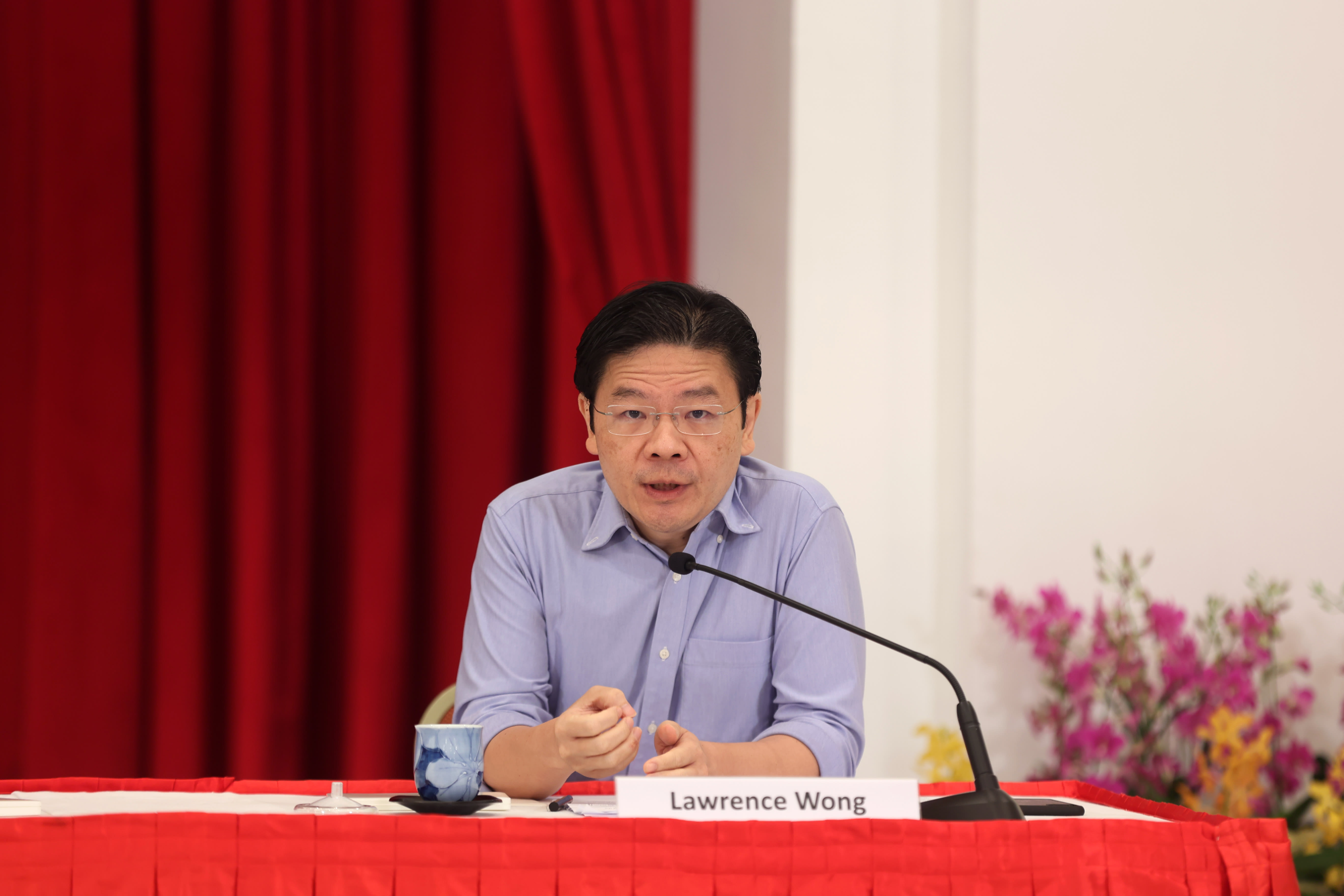 Finance Minister Lawrence Wong speaking during the press conference at the Istana on April 16.