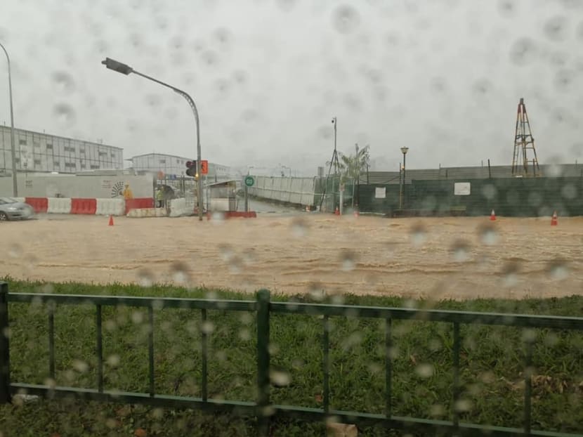In photos shared on social media, murky brown water can be seen inundating parts of a road along Hougang Ave 3 near the Singapore Girls’ Home. In photos shared on social media, murky brown water can be seen inundating parts of a road along Hougang Ave 3 near the Singapore Girls’ Home.