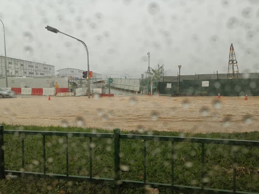 In photos shared on social media, murky brown water can be seen inundating parts of a road along Hougang Ave 3 near the Singapore Girls’ Home.