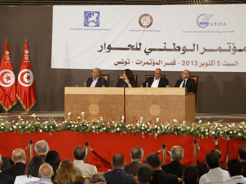 Members of Tunisia's National Dialogue Quartet (seated) look on as Tunisia's President Moncef Marzouki addresses the National Conference for Dialogue in Tunis on Oct 5. Photo: Reuters
