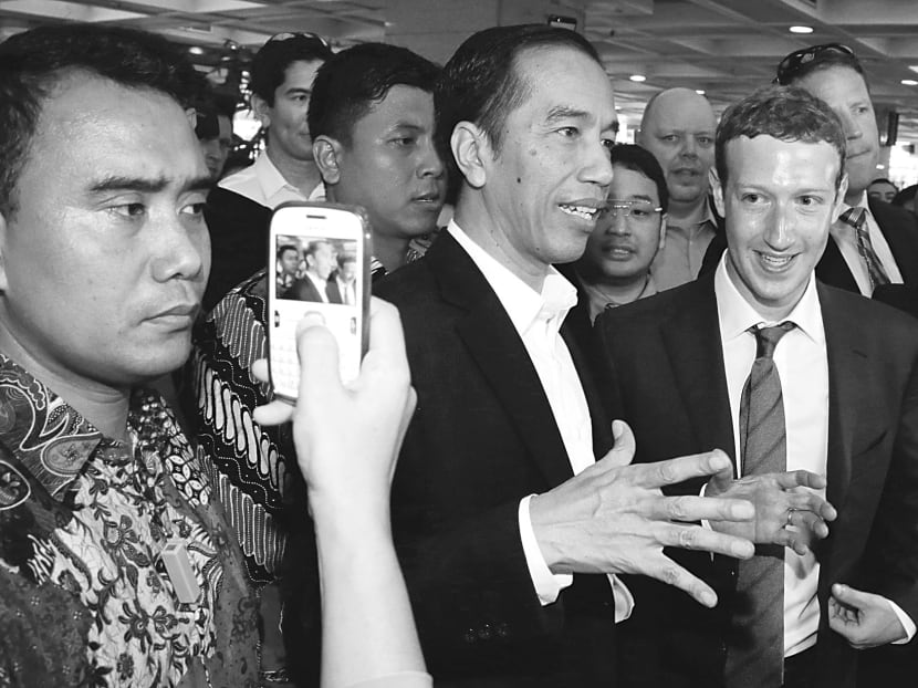 Indonesian President-elect Joko Widodo (left) meeting Facebook founder Mark Zuckerberg in Jakarta earlier 
this week. Mr Widodo’s inauguration is on Monday. Photo: AP