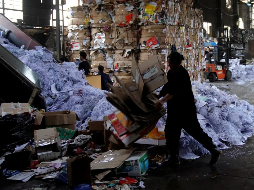 Labourers work at a paper products recycling station in Shanghai, China. Ever since China announced last year that it no longer wanted to be the “world’s garbage dump,” recycling about half the globe’s plastics and paper products, Western nations have been puzzling over what to do. Photo: Reuters