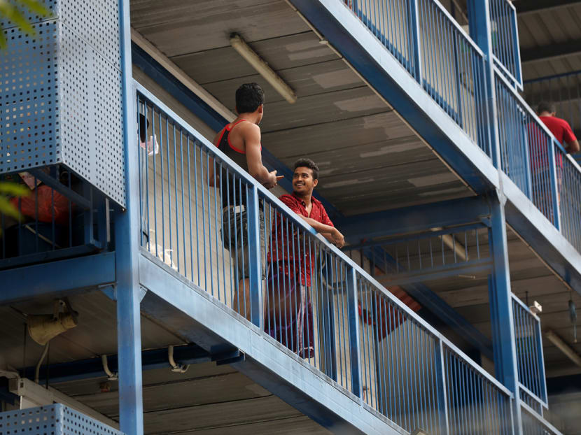 Residents of S11 Dormitory @ Punggol are seen chatting with each other. Preliminary links have been established between the clusters at Mustafa Centre, the construction site of Project Glory and five dormitories, including S11 Dormitory.