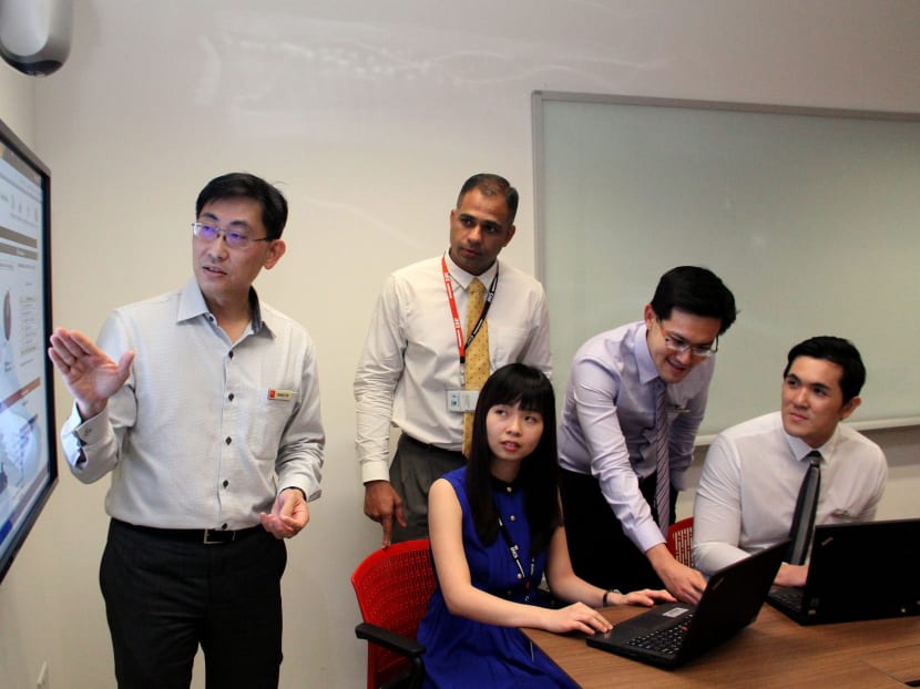 (From Left) Mr Benedict Tan, group chief information officer, SingHealth, Mr S M Arish, deputy director of IHiS’s applications division, Ms Celine Tan, IHiS senior systems specialist, Mr Raymond Teo, assistant manager, SGH operations and performance management and Mr Isaac Wong, senior executive, SingHealth Office of Strategy Management. Photo: Geneieve Teo