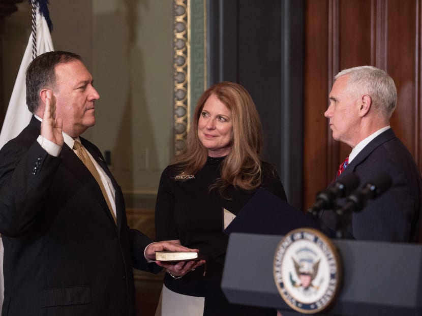 US Vice President Mike Pence (R) swears in Mike Pompeo as CIA director as his wife Susan looks on in the Vice President's Ceremonial Office at the Eisonhower Executive Office Building on Jan 23, 2017 in Washington, DC. Photo: AFP