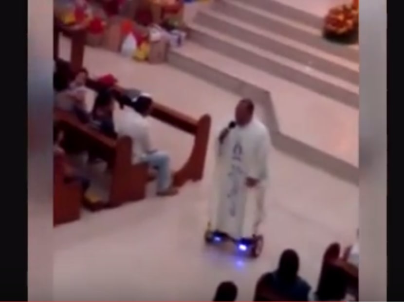A video of a priest in the Philippines celebrating Christmas eve mass on a hoverboard. PHOTO: Screen capture SRC-TV/YouTube