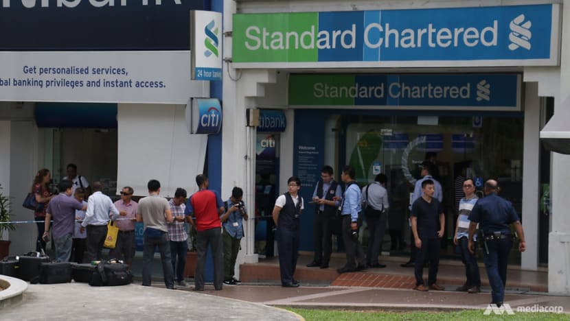 Manhunt for Standard Chartered bank robber at Holland Village Manhunt for Standard Chartered bank robber at Holland Village