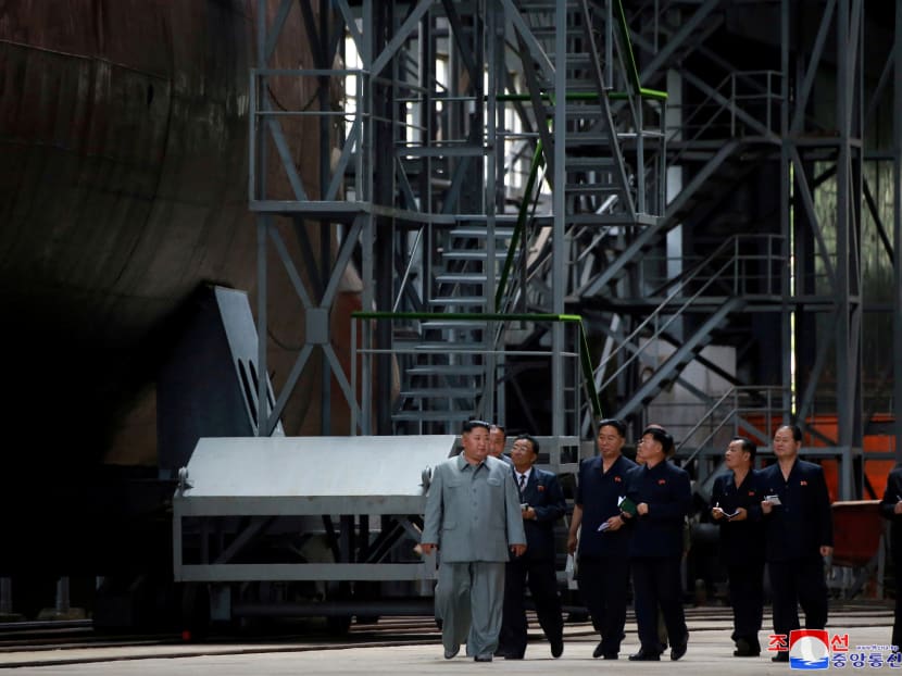 Photo of the day: North Korean leader Kim Jong-un visits a submarine factory in an undisclosed location, North Korea, in this undated picture released by North Korea's Central News Agency (KCNA) on Tuesday, July 23, 2019.