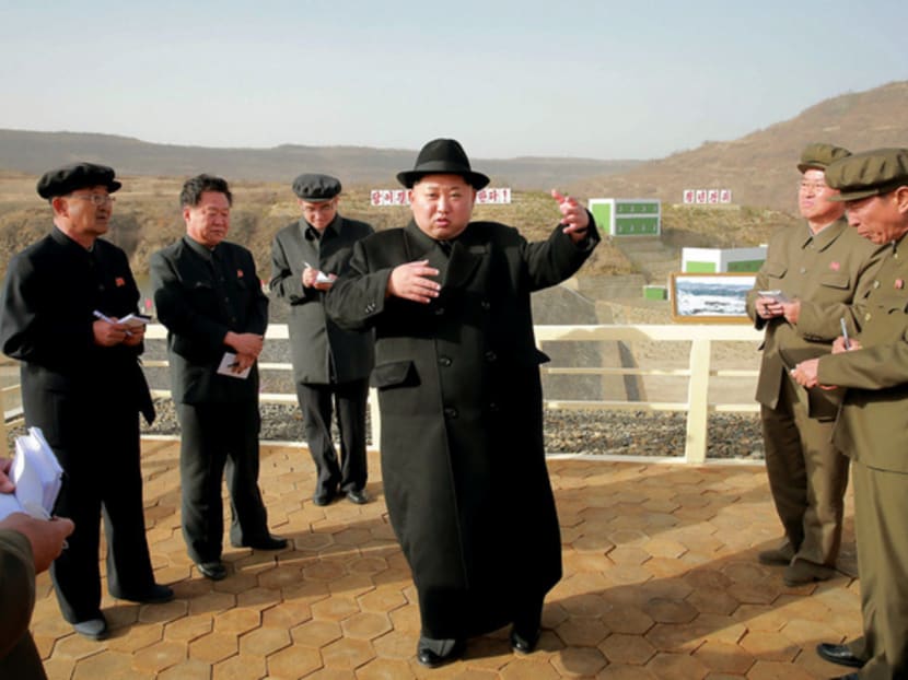 North Korean leader Kim Jong-un (centre) at the Paektusan Hero Youth Power Station No 3 in Ryanggang Province. Mr Kim is expected to cement his leadership status at a party congress this week. There has been speculation as to whether he will continue his controversial focus on nuclear tests. PHOTO: AFP/KCNA VIA KNS