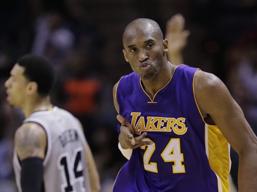 Los Angeles Lakers' Kobe Bryant (24) celebrates after he scored against the San Antonio Spurs during the second half of an NBA basketball game, Friday, Dec. 12, 2014, in San Antonio.  Photo: AP