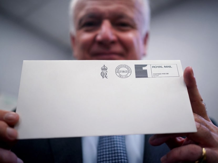 Mr David White, Garter King of Arms, poses with an envelope franked with the new cypher of King Charles III 'CIIIR', after it was printed in the Court Post Office at Buckingham Palace in central London on Sept 27, 2022. Mr David White, Garter King of Arms, poses with an envelope franked with the new cypher of King Charles III 'CIIIR', after it was printed in the Court Post Office at Buckingham Palace in central London on Sept 27, 2022.