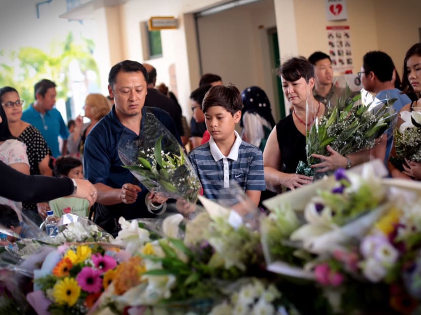People offering their condolences at Tanjong Katong Primary School on June 7, 2015.. Photo: Jason Quah/TODAY