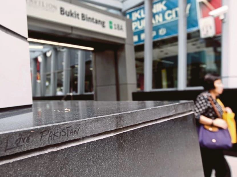 Graffiti which reads ‘I Love Pakistan’ at the Bukit Bintang MRT station in Kuala Lumpur. Commuters said it was everyone’s responsibility to take care of public facilities. Photo: New Straits Times