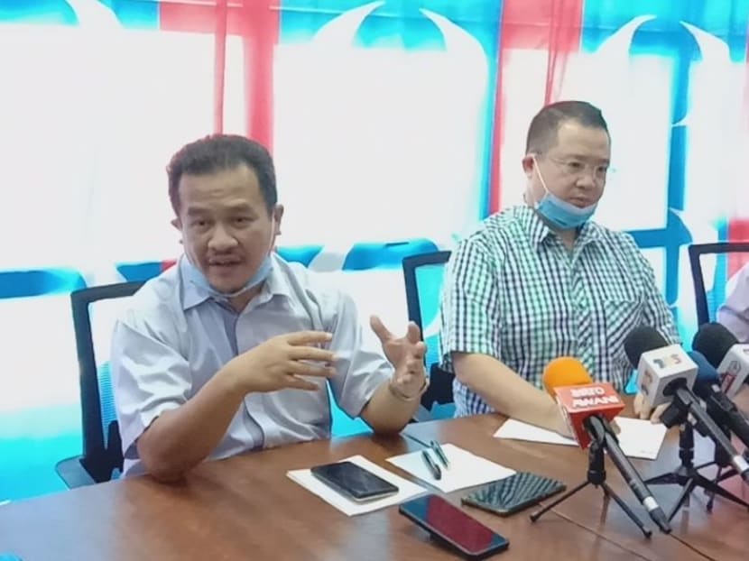 Kedah assemblymen Robert Ling Kui Ee (centre) and Azman Nasarudin (left) have quit PKR to support Perikatan Nasional, triggering the collapse of the Pakatan Harapan state government.