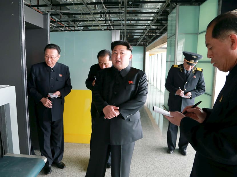 North Korean leader Kim Jong Un (centre) gives field guidance at the construction site of Terminal 2 of Pyongyang International Airport in this undated photo released by North Korea's Korean Central News Agency on April 12, 2015. Photo: Reuters