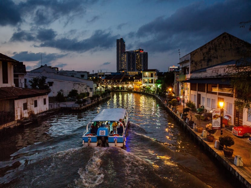 A boat travelling along the Malacca River. China is investing billions in a redevelopment that will see the city become home to a deep sea port. Photo: Bloomberg