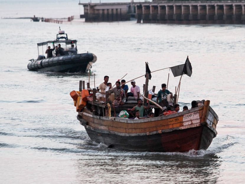 A wooden boat carrying Rohingya refugees children detained in Malaysia territorial waters off the island of Langkawi arrive at a jetty in Kuala Kedah, northern Malaysia on April 3, 2018. A wooden boat carrying Rohingya refugees children detained in Malaysia territorial waters off the island of Langkawi arrive at a jetty in Kuala Kedah, northern Malaysia on April 3, 2018.
