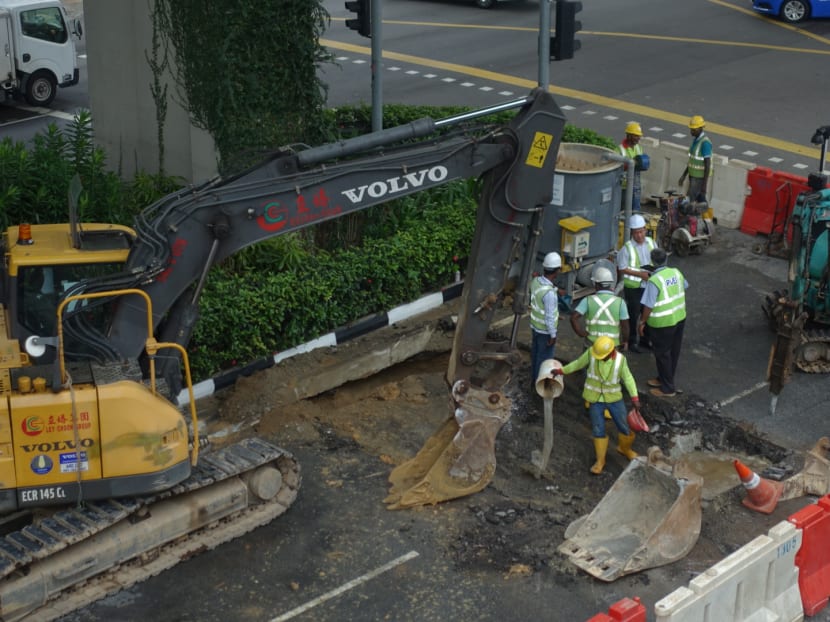 Photo of the day: Urgent repair works being undertaken on a section of Upper Serangoon Road after leaking water from a burst underground pipe shut down two out of three lanes of the road on Monday (Oct 30) morning. Photo: Koh Mui Fong/TODAY