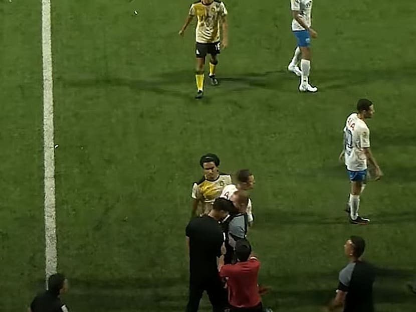 In the foreground, Lion City Sailors’ head coach Kim Do Hoon (left) and Tampines Rovers’ assistant coach Fahrudin Mustafic (right) are seen getting into a scuffle at Jalan Besar Stadium on July 24, 2022.