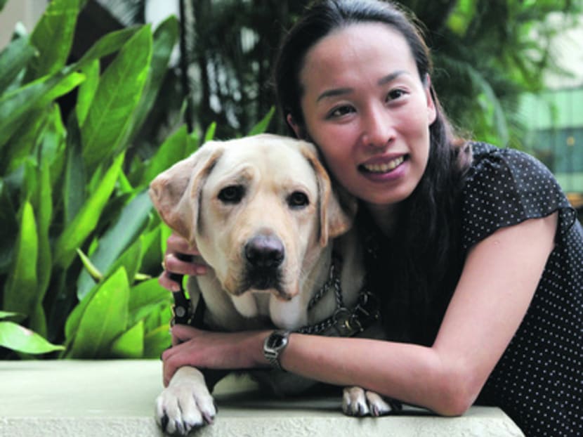 Ms Cassandra Chiu, with her guide dog Esme, said she was once rejected from a sales position when interviewers realised she was blind. Photo: Don Wong