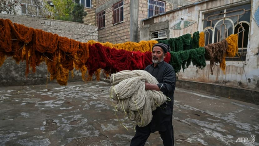 Afghan families go back to making carpets as economy unravels Afghan families go back to making carpets as economy unravels