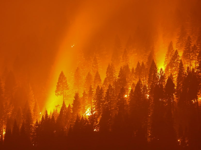 The Dixie Fire, the second-largest in California history, burns at night on July 27, 2021. Climate change is seen as one of its contributing factors.