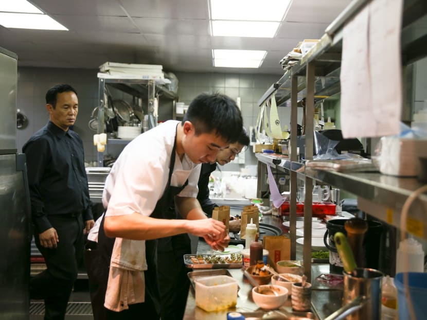 Spanish restaurant, Alma, which has been listed on the guide for two years, puts in a lot of effort to maintain its one Michelin star. Every day, its staff assemble the 14 different dishes offered from more than 100 components, such as pickled cabbage and vinaigrette of yuzu. Photo: Koh Mui Fong/TODAY Spanish restaurant, Alma, which has been listed on the guide for two years, puts in a lot of effort to maintain its one Michelin star. Every day, its staff assemble the 14 different dishes offered from more than 100 components, such as pickled cabbage and vinaigrette of yuzu. Photo: Koh Mui Fong/TODAY
