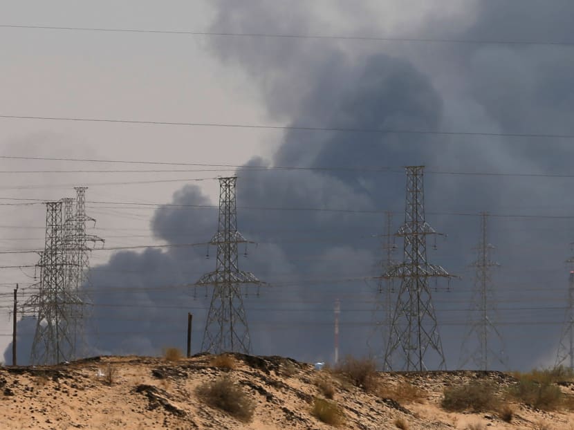 Smoke is seen following a fire at an Aramco factory in Abqaiq, Saudi Arabia on Sept 14, 2019.