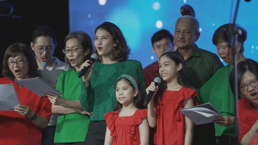 after months of practice the choir stands on stage preparing to sing the first christmas carole