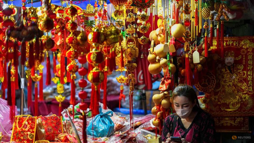 For Chinese Lunar New Year tourists, retailers roll out rabbit dances, red lanterns