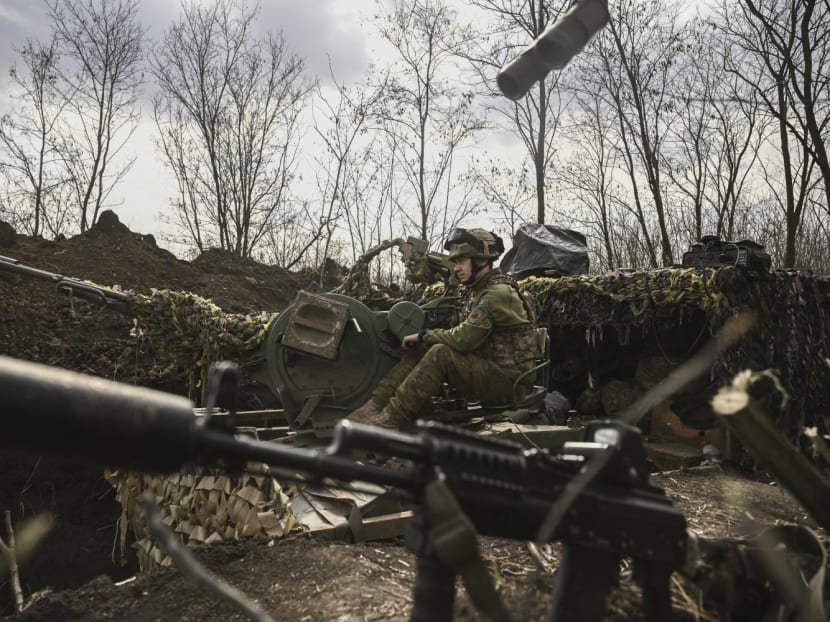 An Ukrainian serviceman sits on an anti-air gun near Bakhmut, on March 24, 2023. An Ukrainian serviceman sits on an anti-air gun near Bakhmut, on March 24, 2023.