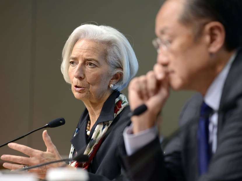 IMF Managing Director Christine Lagarde makes remarks to the press as World Bank President Jim Yong Kim listens at the conclusion of the IMF and World Bank's Development Committee meeting during the IMF and World Bank's 2014 Annual Spring Meetings in Washington, April 12, 2014.    Photo: Reuters
