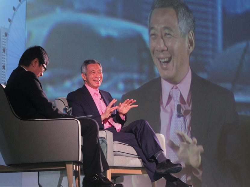 Prime Minister Lee Hsien Loong speaking at a dialogue during International Enterprise Singapore's 30th Anniversary Dinner with moderator Robin Hu, CEO, South China Morning Post Group. Photo: Don Wong