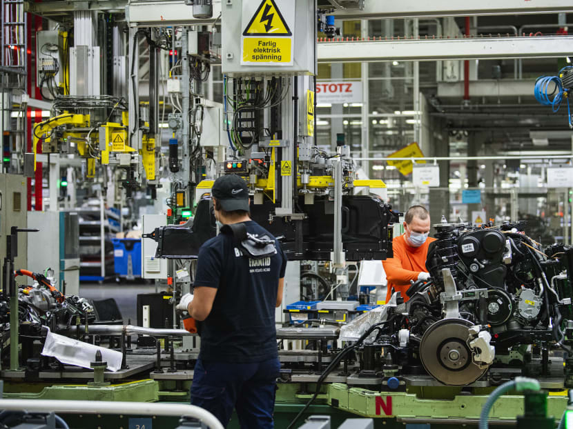 Employees work at the production line of Swedish auto maker Volvo Cars's Torslanda production plant in Gothenburg, Sweden on August 25, 2020. Employees work at the production line of Swedish auto maker Volvo Cars's Torslanda production plant in Gothenburg, Sweden on August 25, 2020.