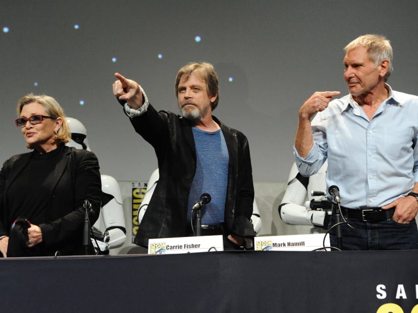 Carrie Fisher, from left, Mark Hamill, and Harrison Ford attend Lucasfilm's "Star Wars: The Force Awakens" panel on day 2 of Comic-Con International on Friday, July 10, 2015, in San Diego, Calif. Photo: AP