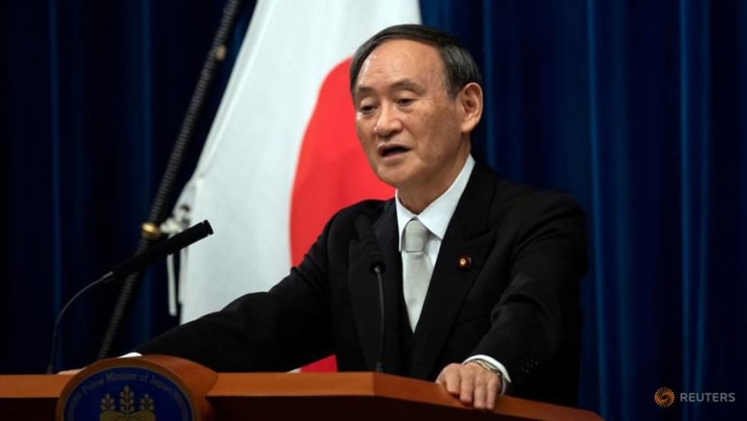 Japan PM Suga 'determined' to hold Olympics despite pandemic Japan PM Suga 'determined' to hold Olympics despite pandemic