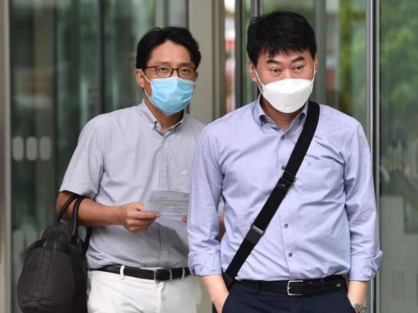 Ro Sungyoung (left) and Kim Young-Gyu outside the State Courts on July 24, 2020.