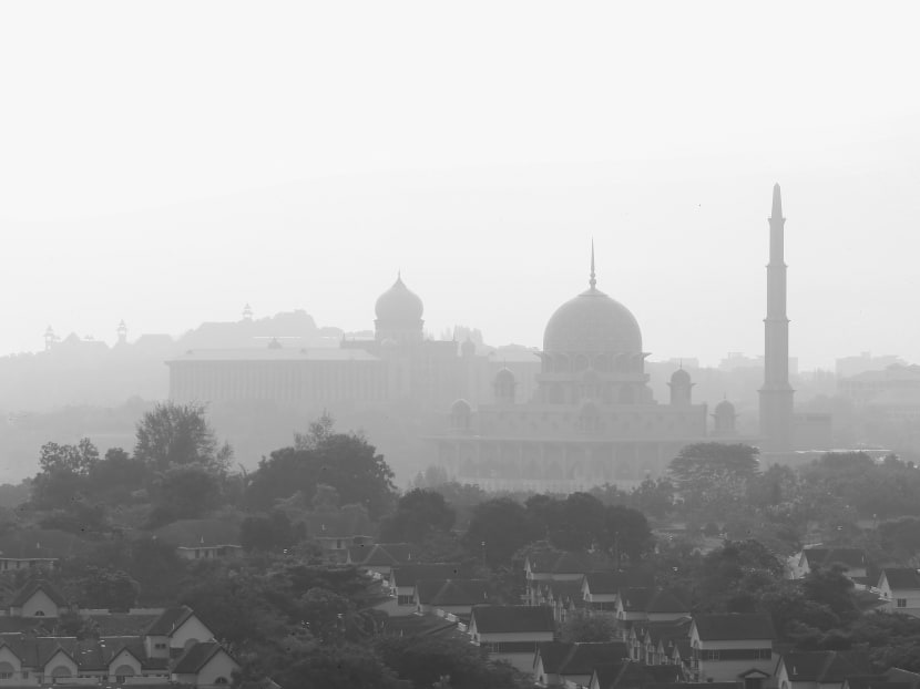 The Malaysian city of Putrajaya is shrouded with haze. Photo: Reuters