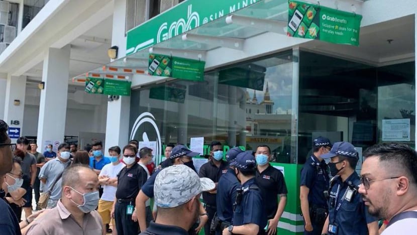 Grab forced to close centre after crowd forms to collect food delivery bags amid COVID-19 measures