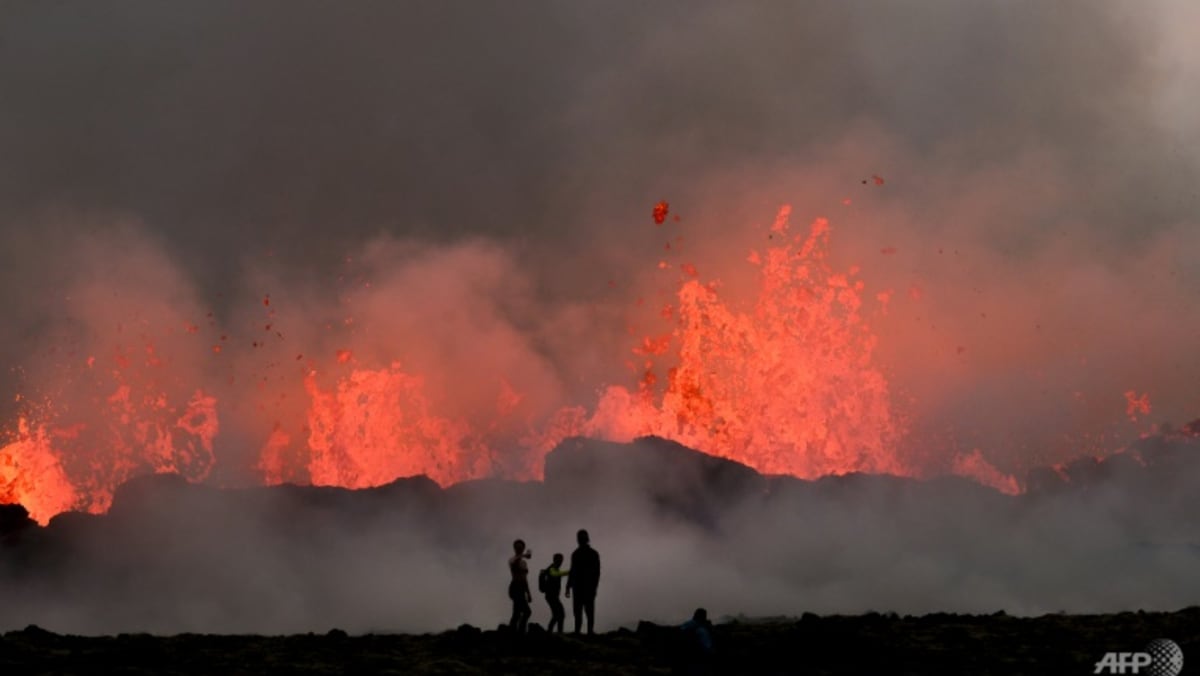 ‘Orange like the sun’: Visitors flock to Iceland volcano