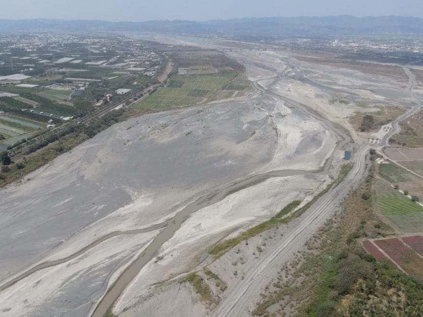 This picture taken on March 16, 2021 shows an aerial view of the dry Ai Liao River bed in Taiwan's Pingtung county. More than one million households and businesses in Taiwan's heavily industrialised central regions were put on water rationing on April 6, 2021, as the island battles its worst drought in 56 years.