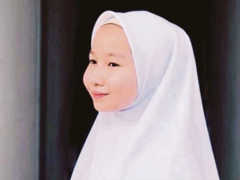 Nur Iman Safiyah Mohammed Shahree, a Form 2 student, is the  proud owner of her very own 'tudung bawal' range, named Baluna Bawal, which is targeted at schoolgirls. Photo: New Straits Times