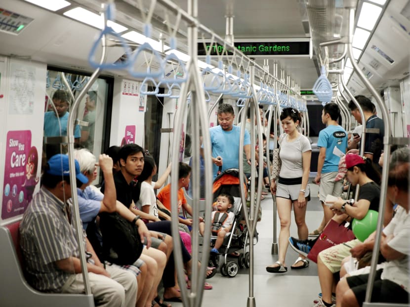 Commuters riding on the Downtown Line 2. TODAY file photo.