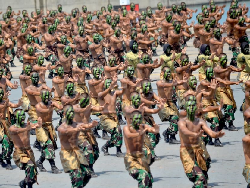 Indonesian soldiers display their fighting skills at the Barang Indah Kiat port during a military parade to mark the 72nd anniversary of the Indonesian military's founding, in Cilegon on Oct 5, 2017.