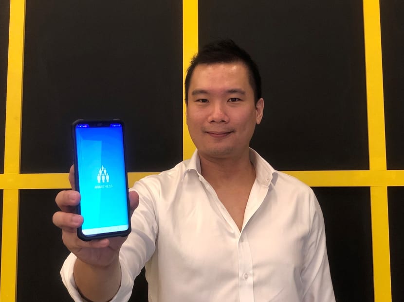 Nervotec founder Jonathan Lau with his firm’s Awareness mobile application, which can measure a user’s heart rate and oxygen saturation with just a front-facing camera.