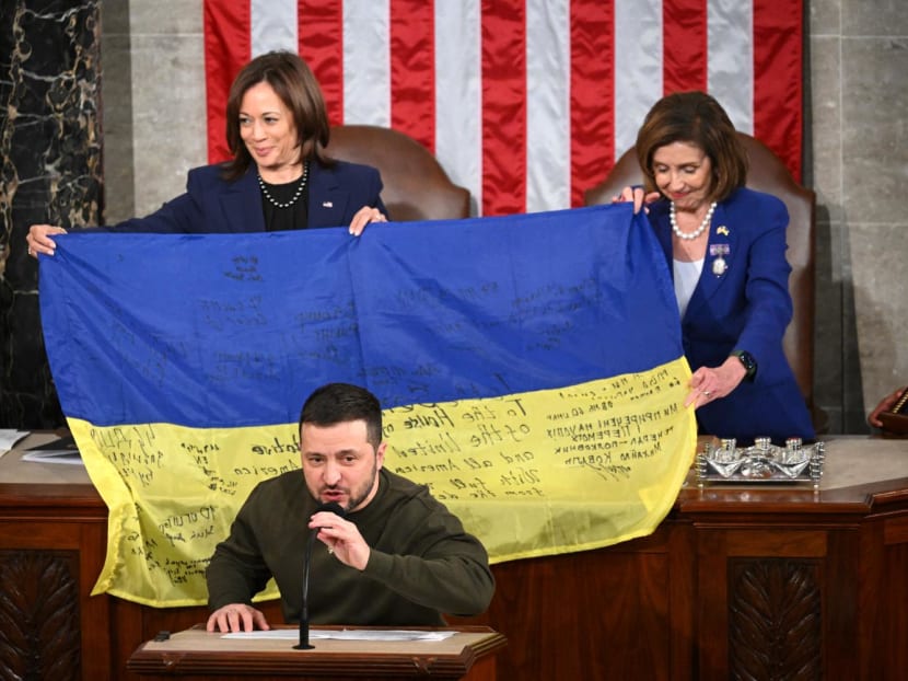 Ukraine's President Volodymyr Zelensky speaks after giving a Ukrainian national flag to United States (US) House Speaker Nancy Pelosi and US Vice President Kamala Harris during his address the US Congress at the US Capitol on Dec 21, 2022.