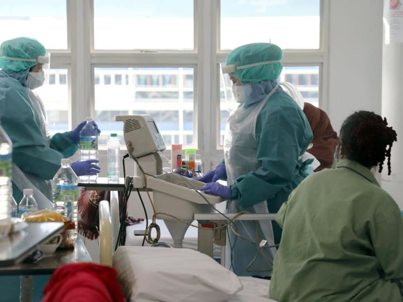 Nurses wearing protective suits work inside the Covid-19 ward at Kuala Lumpur Hospital, in Kuala Lumpur, Malaysia.